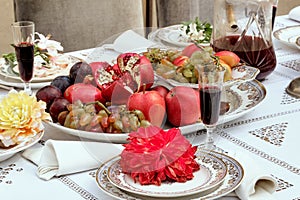 Beautiful still life with fruits, flowers and red wine