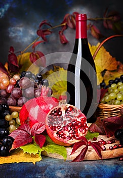 Beautiful still life with wine glasses, grapes, pomegranate