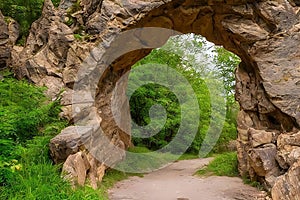 A beautiful stone arch architecture, nature landscape, brick archway, generative ai