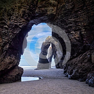 Beautiful stone arches on Playa de las Catedrales, Spai photo