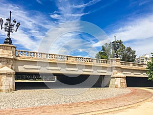 Beautiful stone bridge in turia park Spain with road