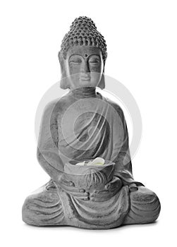 Beautiful stone Buddha sculpture with flower petals isolated on white