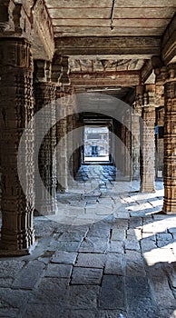 Beautiful stone corridor with stellar sculptures in an ancient Kumbakonam temple, Tamil Nadu, India