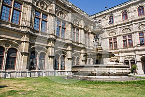 Beautiful stone Fountain with sculptures near the Opera house in Vienna