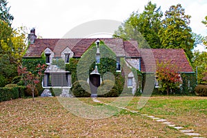 Beautiful stone home covered with greenery