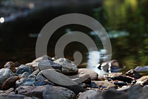 beautiful stones with a river in the background photo