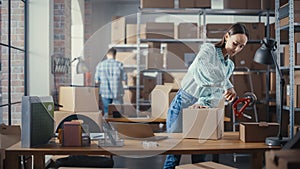 Beautiful Storeroom Worker Preparing a Small Parcel for Postage. Inventory Manager Taping a