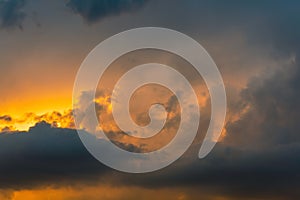 Beautiful storm cumulus clouds in the sky during sunrise or sunset, background