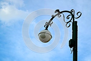 Beautiful street lamp against cloudy blue sky of Cusco, Peru