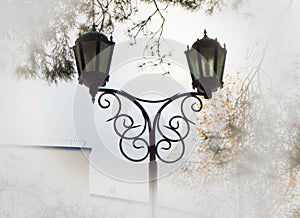 Beautiful street lamp against the sky and trees, added vignette light edges for clouds and haze