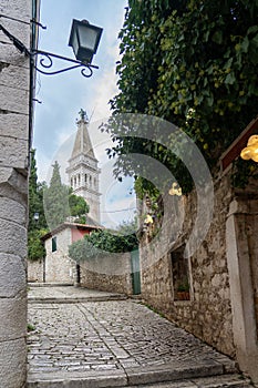 beautiful street of Rovinj Croatia with cobblestone and church tower
