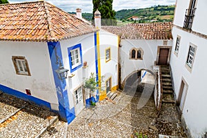 Beautiful street in Ã“bidos with traditional architecture and colors