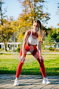 Beautiful strong and fit woman working out outside