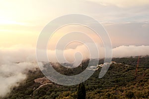 Beautiful structure of clouds on sky, mountain landscape with dense fog at sunset on horizon of beauty natural environment.