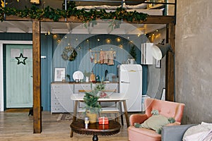 Beautiful Studio apartment in Scandinavian style, decorated for Christmas and New Year, kitchen and table