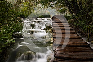 The beautiful and stunning Plitvice Lake National Park, Croatia, close up shot of a waterfall with broad walk on right hand side