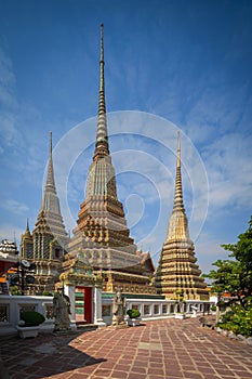 Beautiful stupas decorated with colorful mosaic big pagoda and Thai art architecture of Wat Pho temple in Bangkok, Thailand
