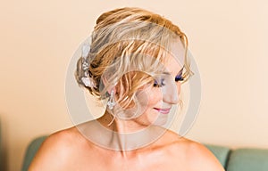 Beautiful stylish bride getting ready in the room