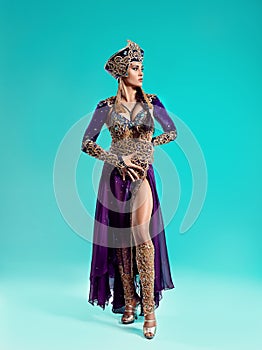 The beautiful stylish brunette young woman as Cleopatra