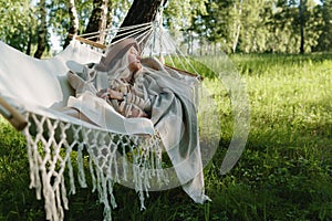 Beautiful stylish countryside woman on the hammock close up