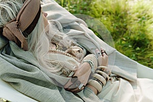 Beautiful stylish countryside woman on the hammock close up