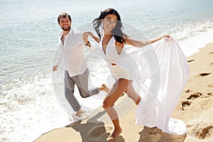 Beautiful stylish couple just married, have escape in Greece in summer time, perfect sunny day.