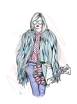Beautiful stylish girl in a fur coat, trousers and glasses. Fashionable clothes and accessories. Fashion & Style.