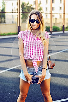 Beautiful stylish girl posing outdoor