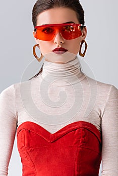 Beautiful, stylish girl in red sunglasses