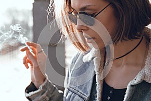 Beautiful and stylish girl in sunglasses on a sunny day