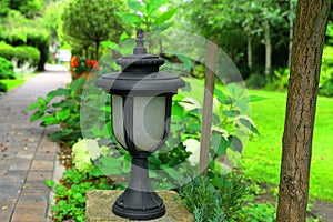 A stylish lighting lamp in the home garden photo