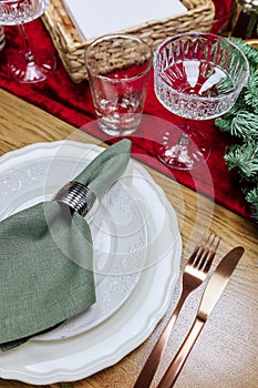 Beautiful and stylish table setting with Christmas decorations in the living room.