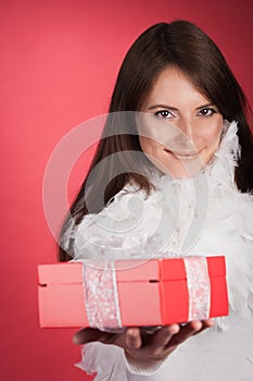 Beautiful stylish woman with a red gift box