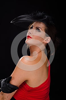 Beautiful, stylish woman wearing a fascinator and