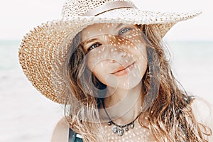 Beautiful stylish young woman portrait with hat shadow on face