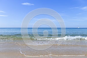 Beautiful summer beach with clear blue sky, relaxing by the peaceful beach