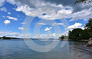 Beautiful Summer Day with Fluffy White Clouds Above Casco Bay