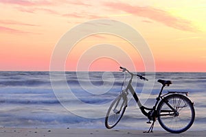 Beautiful summer evening.Bicycle by the Baltic sea photo
