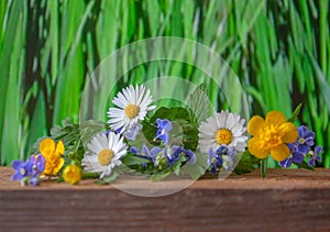 Beautiful summer flowers on a wooden background. Florar theme.