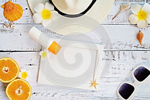 Beautiful summer holiday, Beach accessories, orange, sunglasses, hat and shells on wooden backgrounds