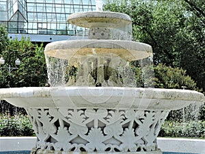 Beautiful summer landscape with  white stone fountain in the park of Moscow