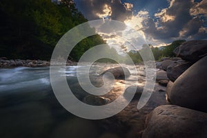 Beautiful summer landscape. Fast flowing mountain river