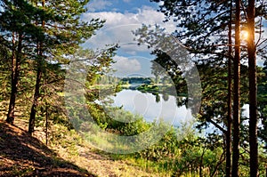 Beautiful summer landscape of meadows near the river and forest. The upper reaches of the Volga River in the Tver region of Russia