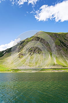 Beautiful summer landscape with Monte Motto and Lake Livigno, Italy