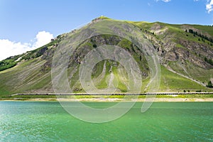 Beautiful summer landscape with Monte Motto and Lake Livigno, Italy