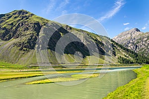 Beautiful summer landscape with Monte Motto and Lake Livigno, Italy