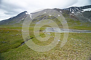 A beautiful summer landscape of mountain river in Sarek National Park, Sweden.