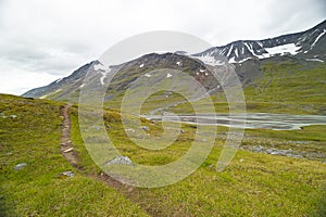 A beautiful summer landscape of mountain river in Sarek National Park, Sweden.