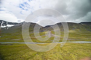 A beautiful summer landscape of mountain river in Sarek National Park, Sweden.