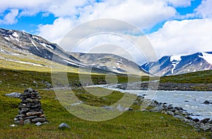 A beautiful summer landscape of mountain river in Sarek National Park, Sweden.